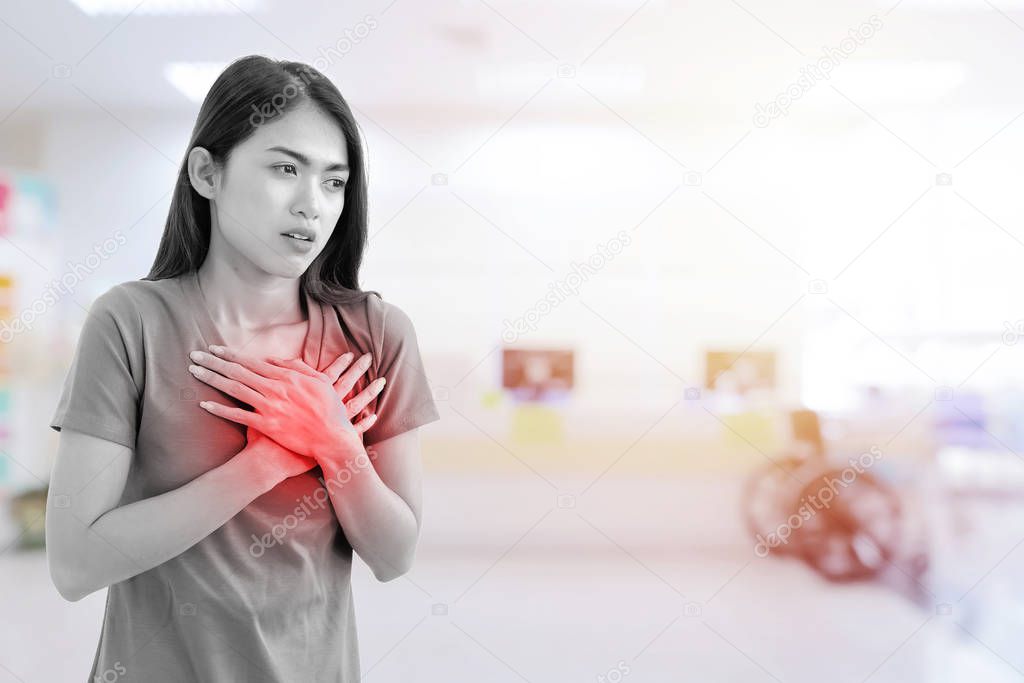 Cute Asian woman has acute heart disease, Hospital background, B