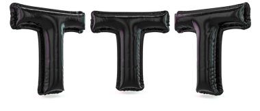 Büyük harf T büyük harf. Arka planda şişme siyah balon var. 3B görüntüleme