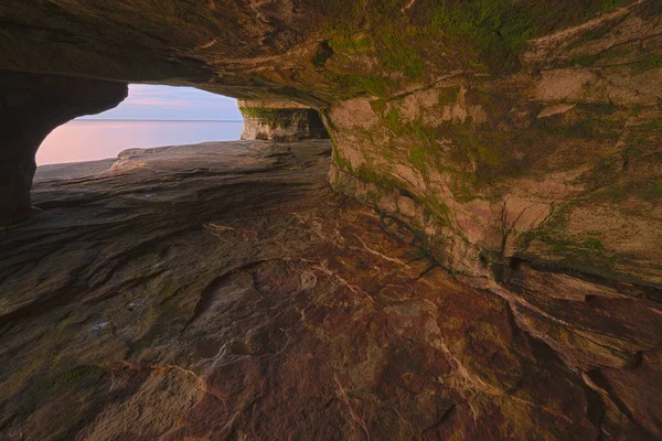 Landscape near sunset of the interior of a sea cave, Paradise Point, Lake Superior, Michigans Upper Peninsula, USA