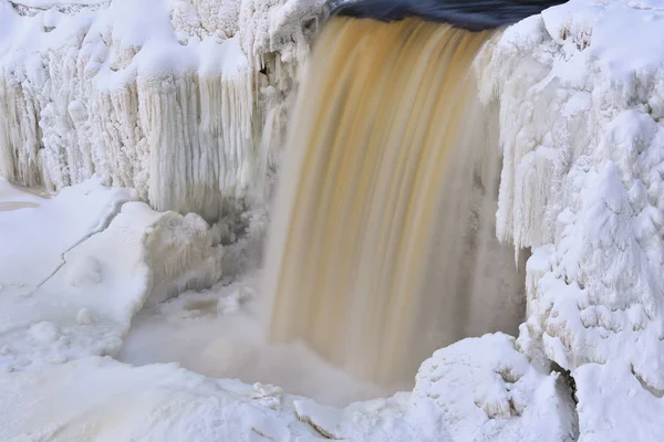 Winter, Upper Tahquamenon Falls framed by ice and captured with motion blur, Michigan's Upper Peninsula, USA