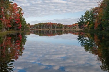 Autumn, Council Lake with mirrored reflections of trees and clouds, Hiawatha National Forest, Michigan's Upper Peninsula, USA