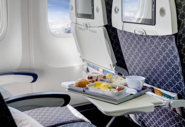 Lunch on board of airplane  clipart