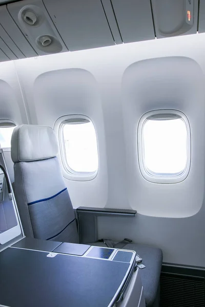 Empty seats and window inside an aircraft