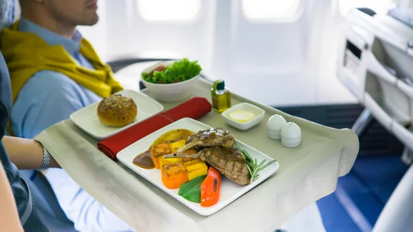 Flight Attendant Serving Meal Airplane — Stock Photo, Image