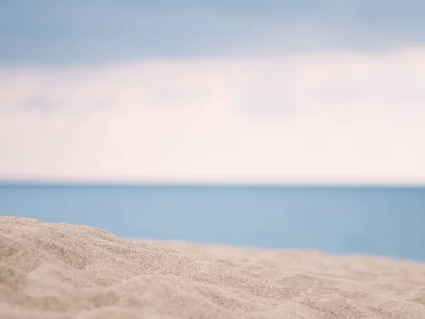 Closeup of sand with sea background — Stock Photo, Image