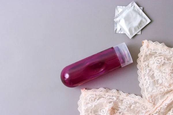 Intimate Lubricant Female Bra Pastel Background Condoms Intimate Gel — Stock Photo, Image