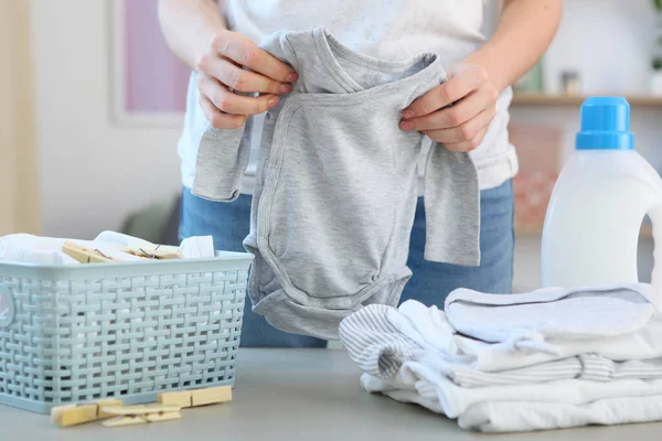 Woman Folds Clean Fresh Baby Clothes Washing Baby Clothes — Stock Photo, Image