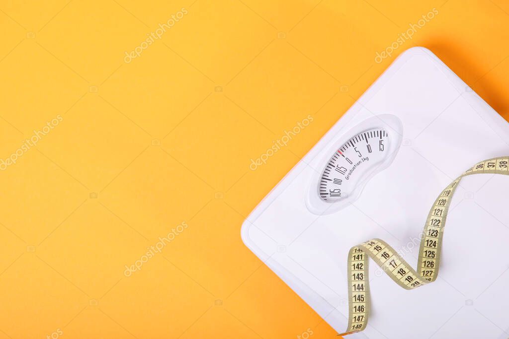 floor scales on a colored background top view.