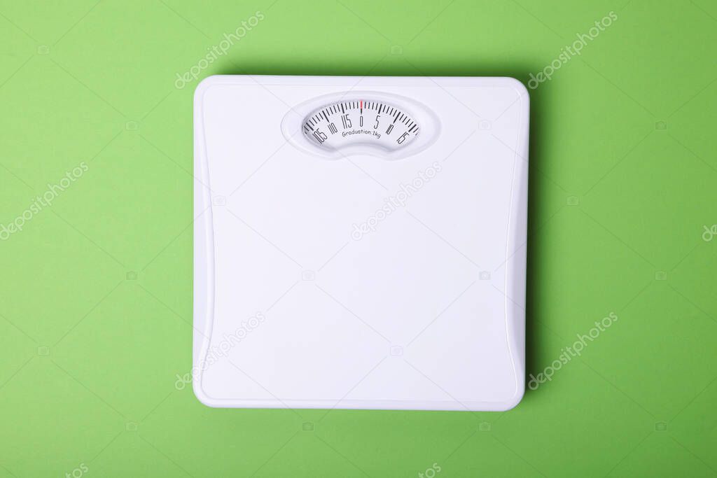 floor scales on a colored background top view.