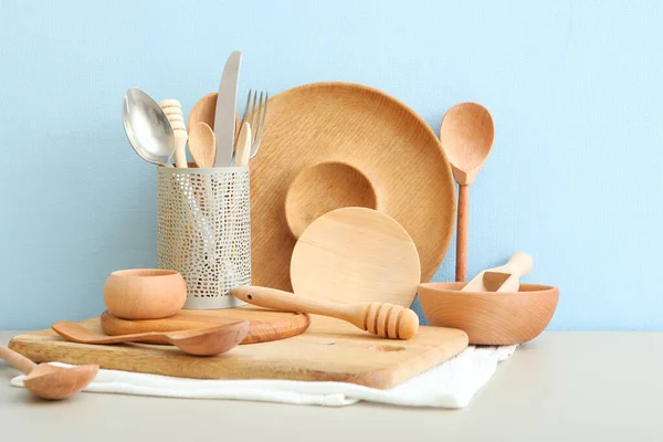 set of dishes made of wood on the table.