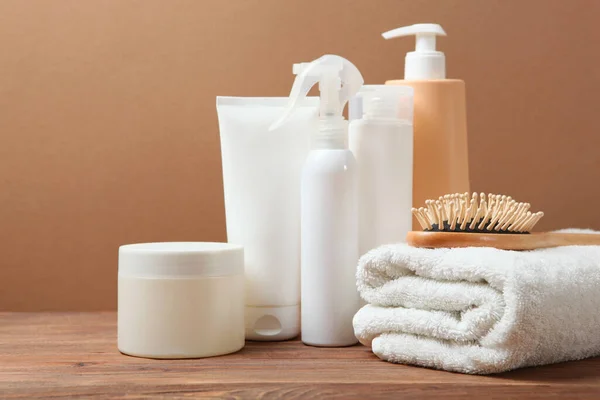 hair care products and a comb on the table.