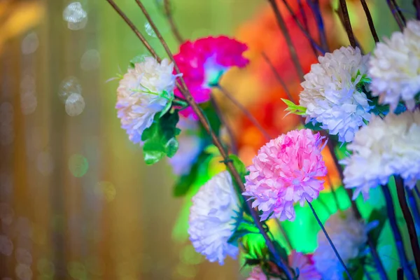 Hand made paper flower stick and colorful lighting. — Stock Photo, Image