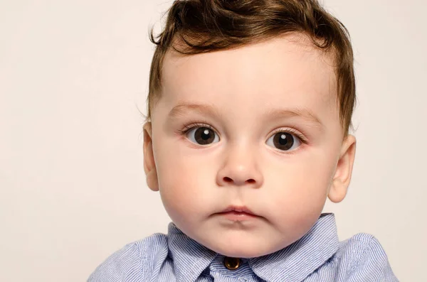 Portrait of a cute baby boy looking at camera. — Stock Photo, Image