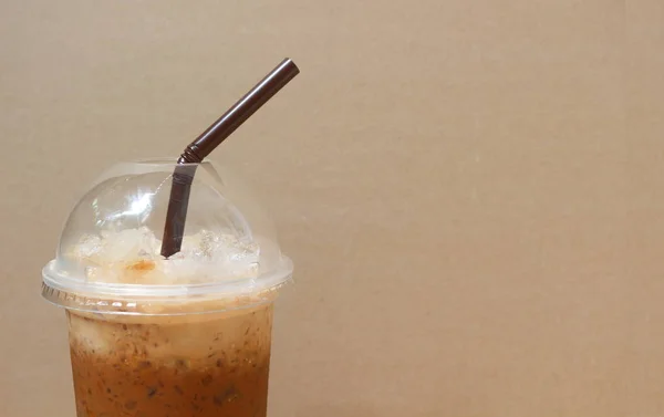 Cup of iced coffee and brown background — Stock Photo, Image