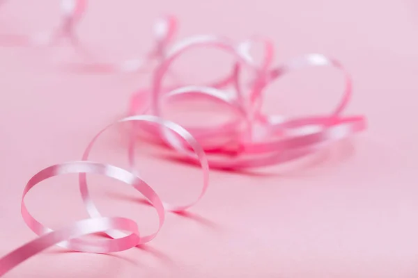 Beautiful pink ribbon on bright background — Stock Photo, Image