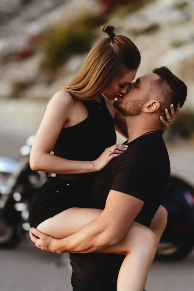 Couple of lovers kissing and hugging on motorbike — Stock Photo, Image