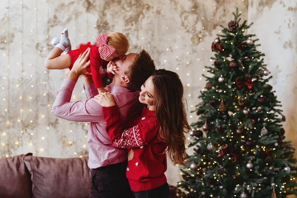 Happy family mother, father and child daughter on Christmas — Stockfoto