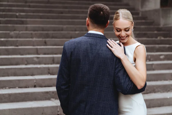 Happy bride and groom near old castle — Stock Photo, Image