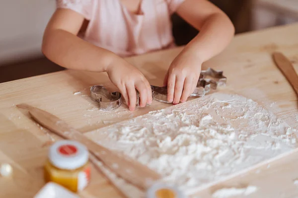 Little girl cooking Christmas biscuits — Stock Photo, Image