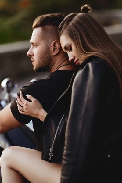Couple of lovers kissing and hugging on motorbike — Stock Photo, Image
