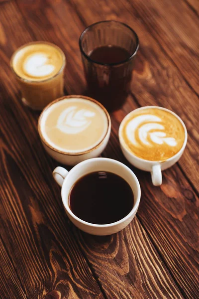 Five cups of coffee on vintage wood. Top view , cup on wooden table. — Stock Photo, Image