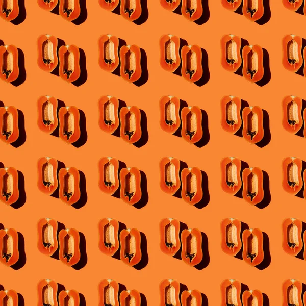 Papaya yaratıcı tropikal desen canlı turuncu arkaplan.