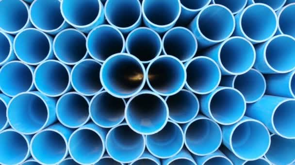 PVC pipes stacked in warehouse. — Stock Video