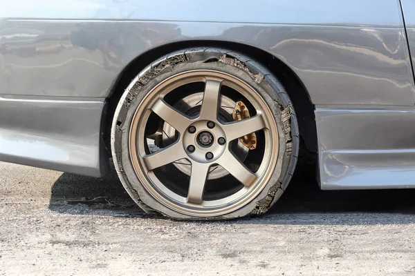 Burst tire on the road — Stock Photo, Image