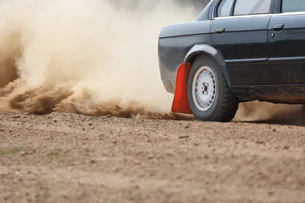 Rally Car turning in dirt track (rear wheel drive) — Stock Photo, Image