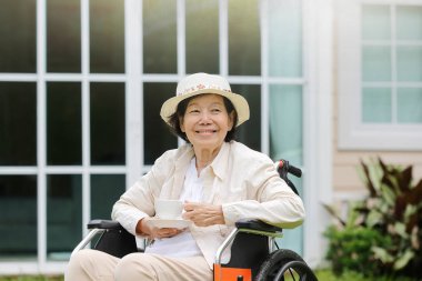 elderly woman relax in backyard clipart