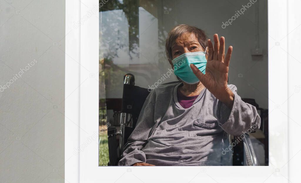 Elderly woman Self-isolation and self-quarantine to help stop the spread of coronavirus (COVID-19) , while you wait for test results.