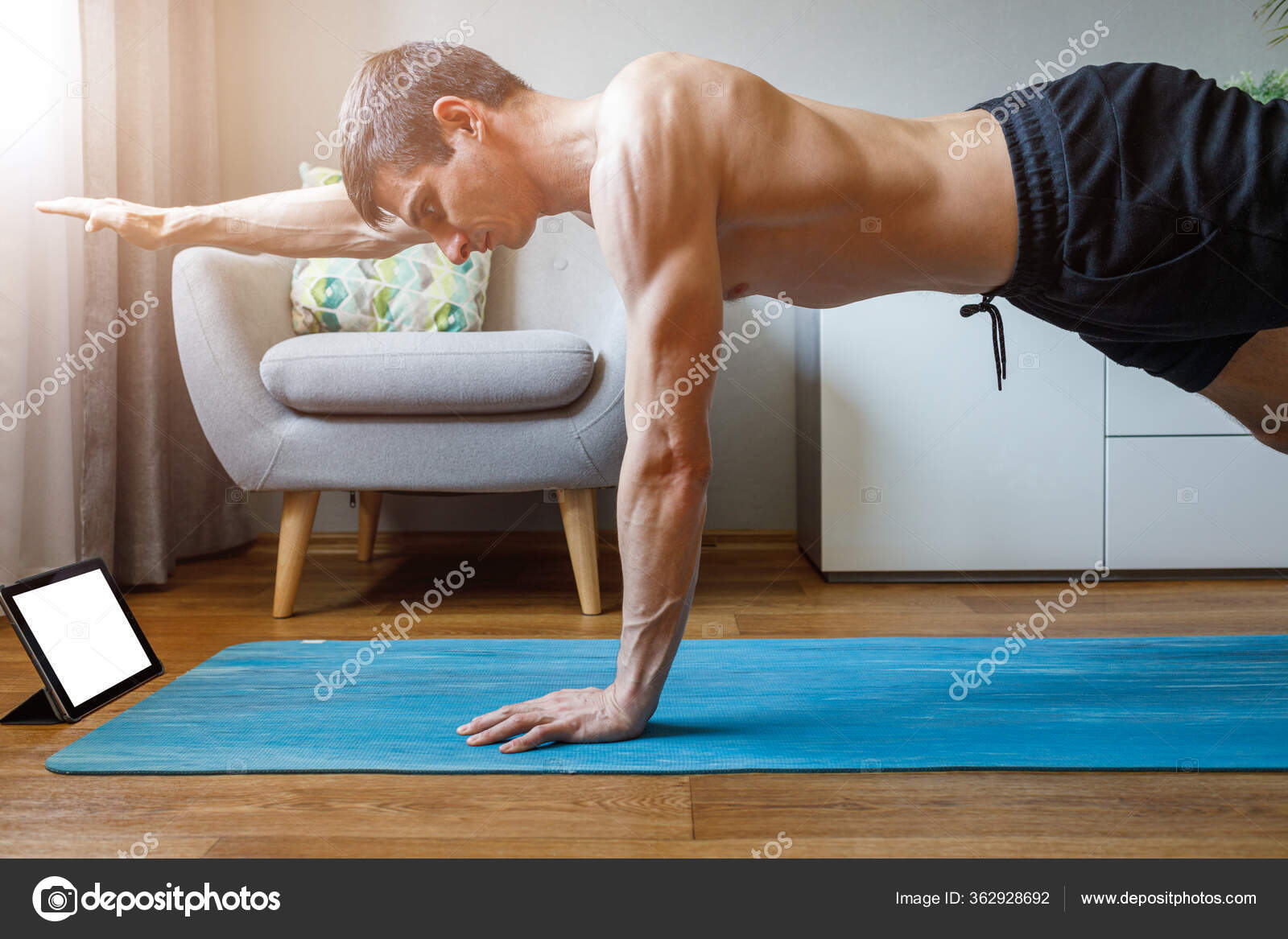 Man Holding One Hand Plank With Online Yoga Class Stock Photo By C Serk