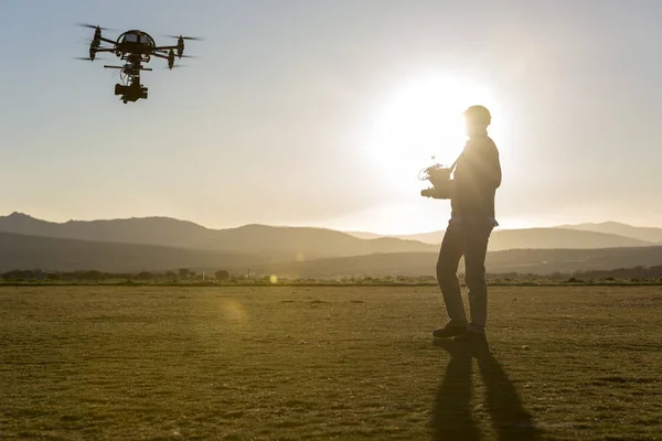 Drone pilot after take off with a cinema drone