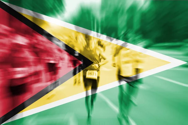 Maratona corridore movimento sfocatura con miscelazione bandiera Guyana — Foto Stock