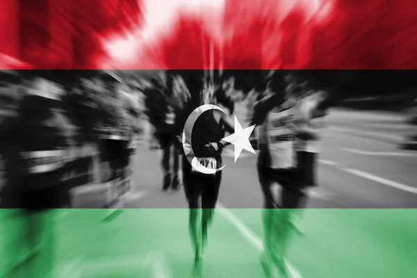 Marathonläufer-Bewegung verschwimmt mit libyscher Flagge — Stockfoto