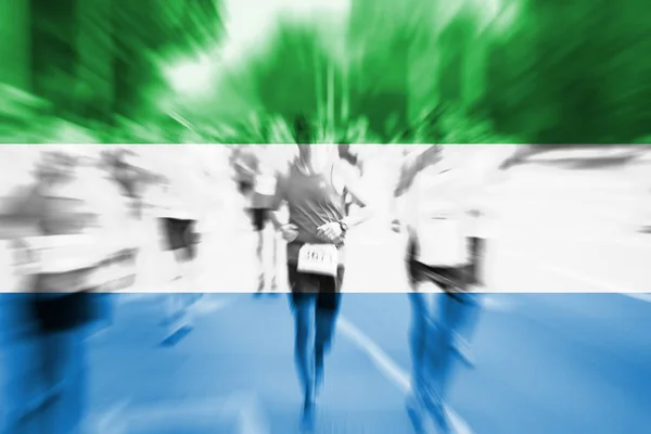 Marathon runner motion blur with blending  Sierra Leone flag — Stock Photo, Image