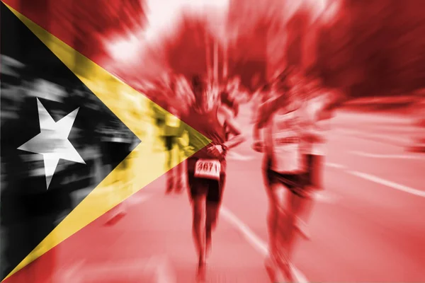 Marathon löpare rörelseoskärpa med blandning Östtimor flagga — Stockfoto