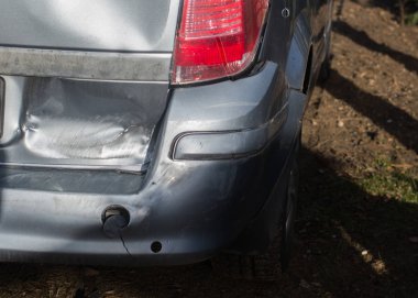 close up on  damage rear bumber in the car clipart