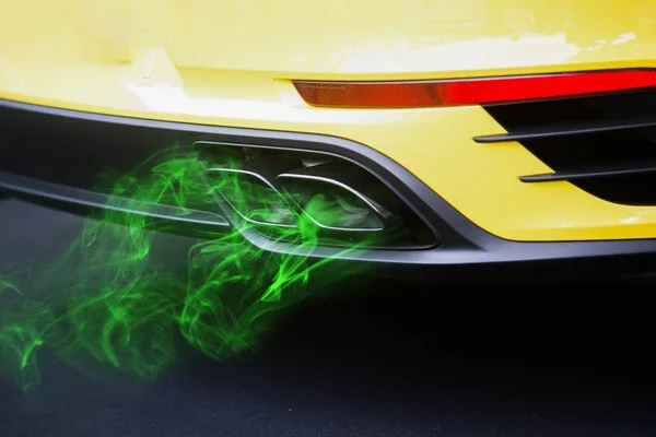 Green eco nature fuel in the car, close up on pollution exhaust — Stock Photo, Image