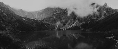 heavy clouds on the sharp Tatra mountain, black and white with n clipart