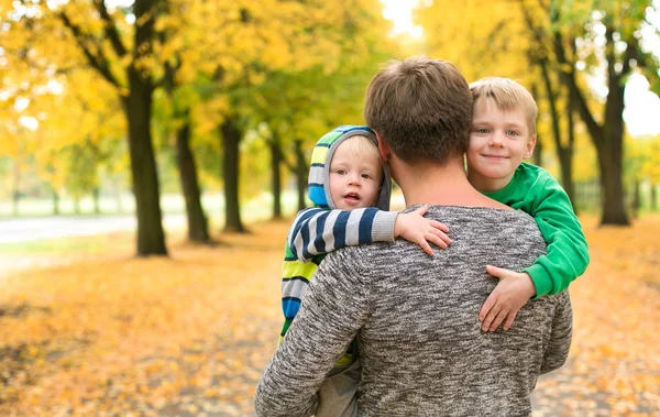 Dad Holding His Two Sons Walk Autumn Park — Stock Photo, Image