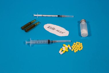 Coronavirus 2019-November. New coronavirus, middle East respiratory syndrome. Tablets, ampoules and syringes with coronavirus text. The Chinese outbreak of coronavirus. The Concept Of Protection Against A Virus Pandemic.