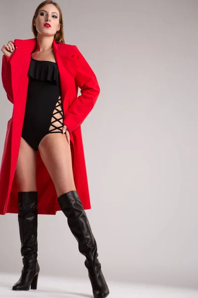 Young Beautiful Female Model Bright Red Raincoat Black Bodysuit Poses — Stock Photo, Image