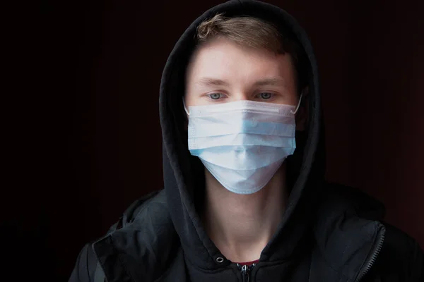 Sad Young Man Protected Coronavirus Medical Mask Looks Sadly Virus — Stock Photo, Image