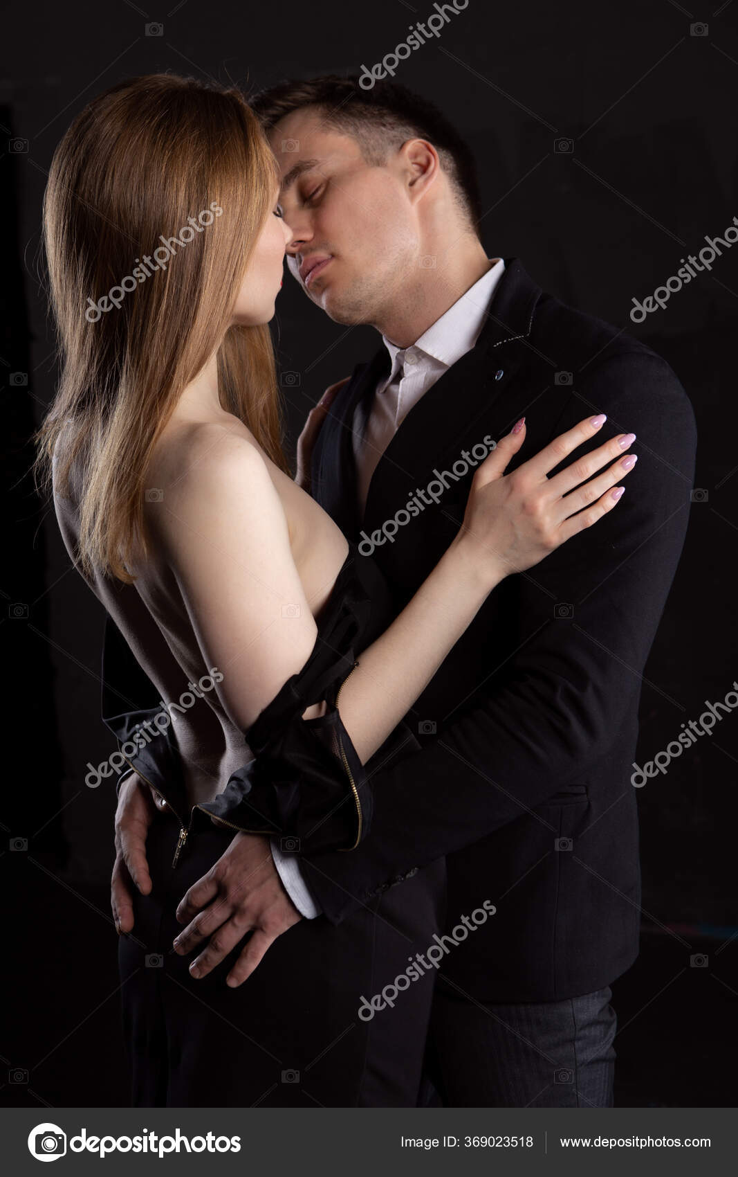 Man Touches Ass Sexy Woman Unbuttoned Dress Passionate Kisses Portrait Stock Photo by ©IvanovDenis43 369023518 photo