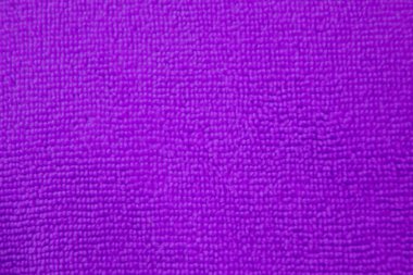 Mor fuşya mikrofiber kumaşın arka planı. Temizlik için kumaş dokusu