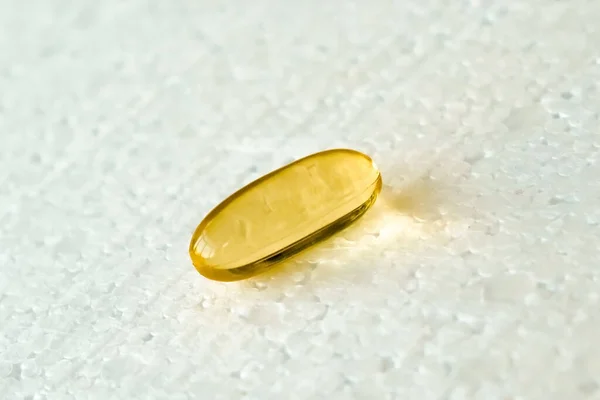 One Capsule Vitamin Omega Lies White Backgroun — Stock Photo, Image