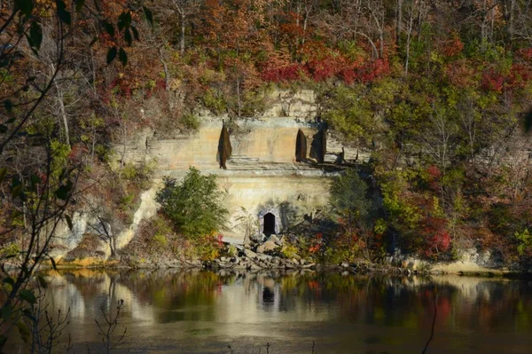 Rustic autumn foliage hues around rocky formations situated above the scenic Mississippi River course thru the Twin Cities, Minnesota.nat