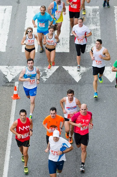 Detalhe dos participantes em uma corrida popular — Fotografia de Stock