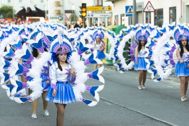 PONTEVEDRA, SPAIN - FEBRUARY 20, 2016: People dressed during the parade held in the city for the Winter Carnival.